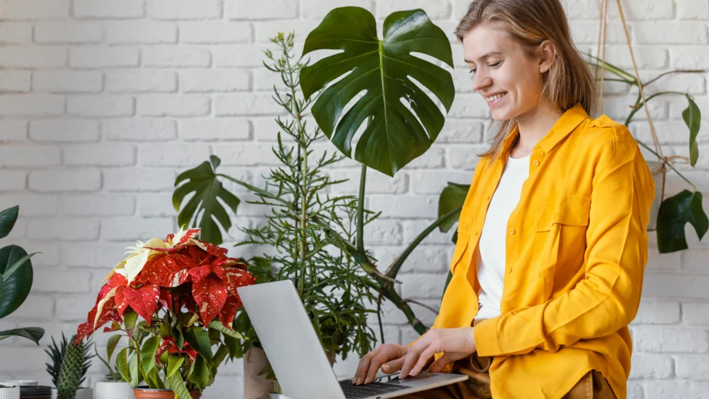 Person watering a common indoor house plant, demonstrating proper indoor plant care and watering techniques